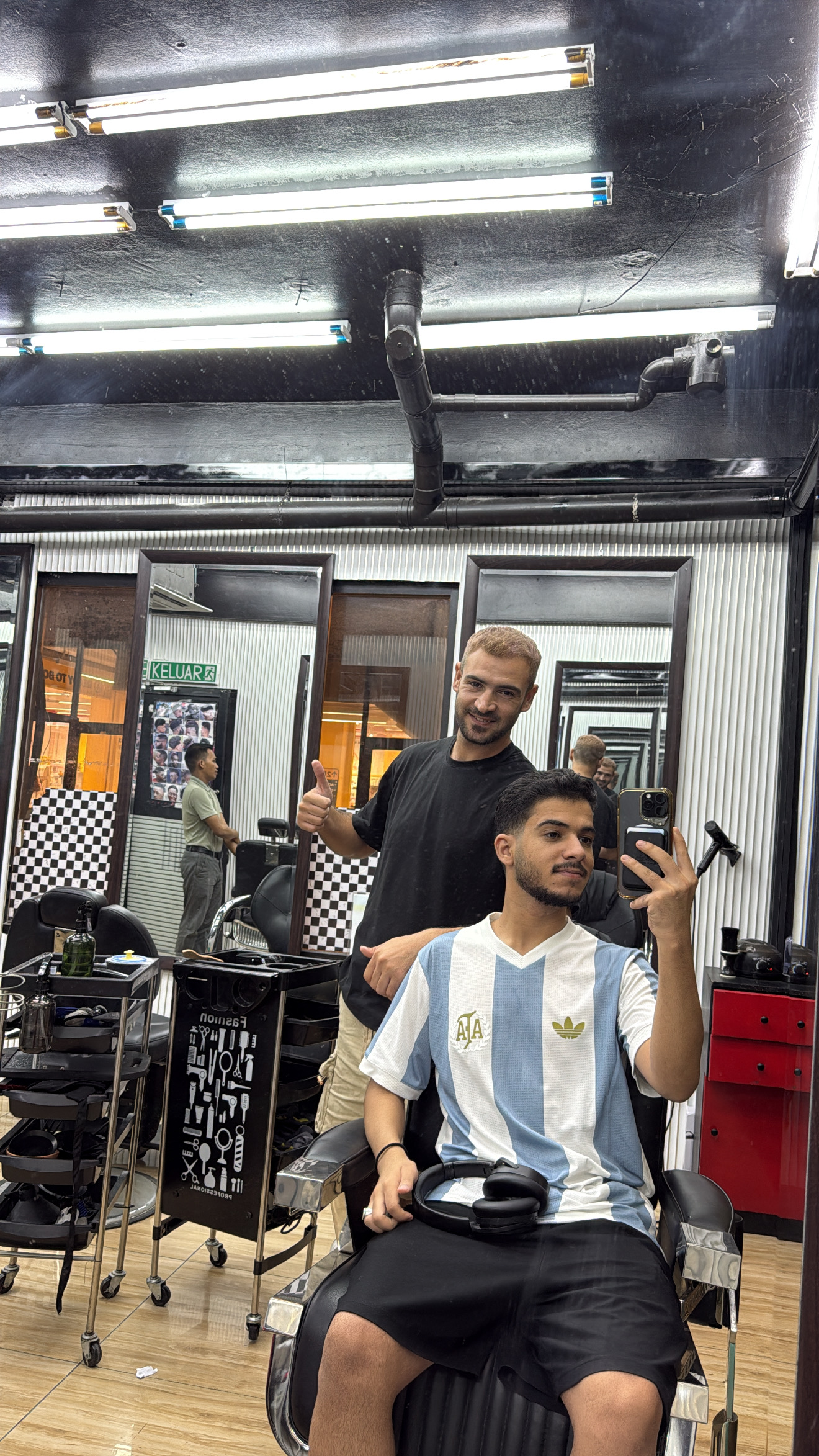 Head Barber at work inside Bukit Bintang Barbershop